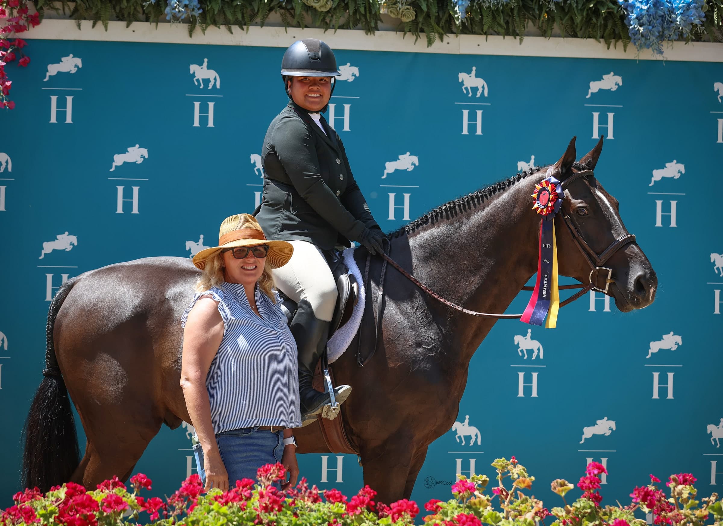 Horse, rider and supporter at a show presentation